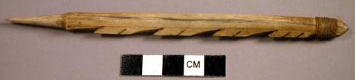 Barbed Eskimo spear foreshaft. Carved bone. Prongs along one side.