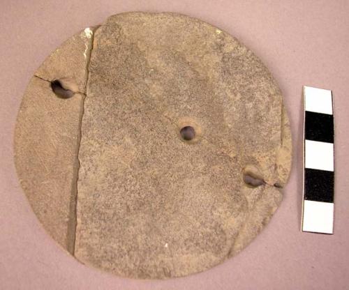 Slate (?) disc perforated ( 3 holes) 3 1/2" d.