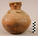 Spouted unpainted pottery jar - human face and arms in relief (also 7 sherds fro