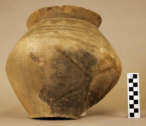 Ceramic jar, partial, steep shoulder, incised design, mended & reconstructed