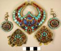 Pair of ornaments (jewelry) - vari-colored semi-precious stones on metal