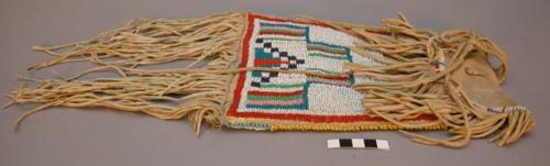 Kiowa beaded bag. Commercial leather base mostly covered w/ buckskin.