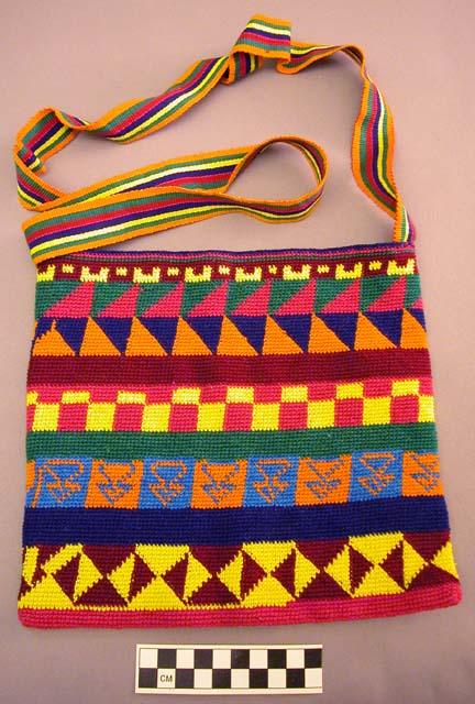 Small morrall or bag crocheted by a man with horizontal multicolored geometric d