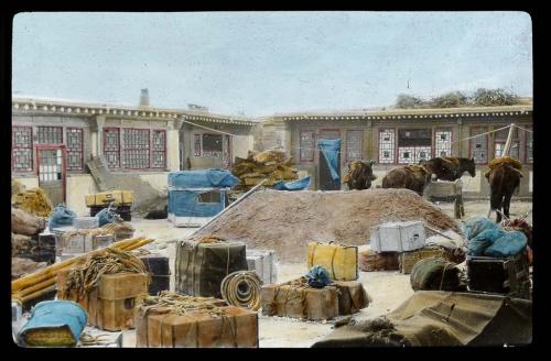 Lantern slide of gear in compound, hand-colored