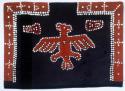 Button blanket. Design shows eagle in center and "coppers" on either side.