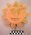 Sun face plaque