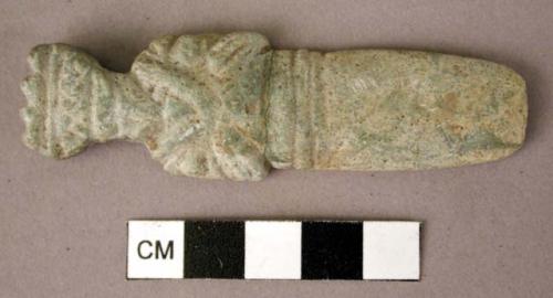 Carved stone pendant, ornamented