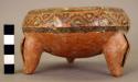 Polychrome pottery tripod bowl