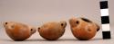 3 miniature rounded-bottom pottery vessels with handles