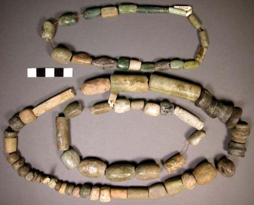 Ground stone; beads; 3 strings of beads