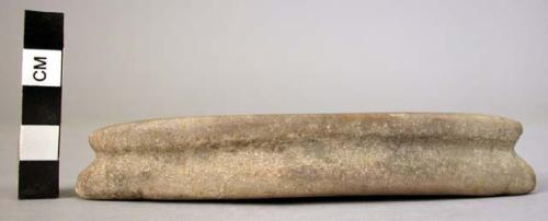 Stone, ground stone, grooved c. edges, weight, elliptical, 1 groove on side