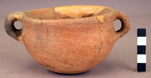 Red pottery bowl with handles