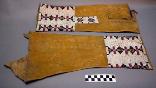 Pair of leggings--skin dyed yellow with beadwork