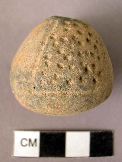 Pottery spindle whorl with punctate design