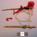 Ornaments, 2 small sticks or twigs, 1 end wrapped w/ colored yarn & cotton strin