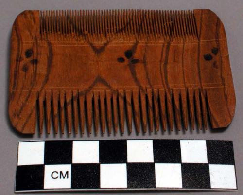 2 wooden combs; 3 3/4 x 2 1/4"