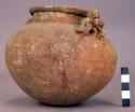 Large pottery jar with two modelled figure lugs - Armadillo ware (restored)