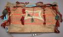 Sioux saddlebag. Trapezoidal shape made from hide, probably bison. Trapezoidal f