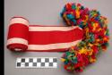 Headband. red and white stripped with multicolored tassels. 255 x 7.5 cm.