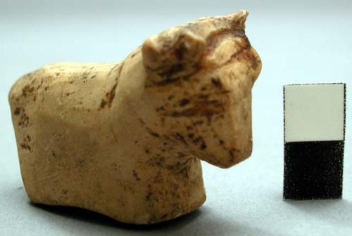 Figurine in the form of a cow with horns