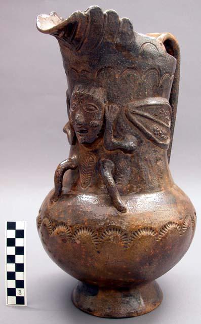 Large pitcher with applied and incised decoration.
