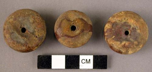 Three large, amber disk-shaped beads