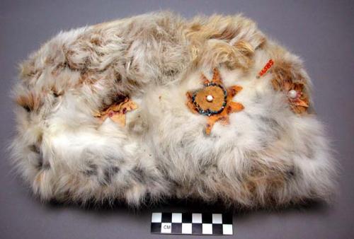 Winter headdress of white hare skin (double). Ornamented on front and sides.