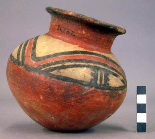 Pottery jar, red base with black and red ornament on upper yellow zone