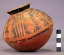 Pottery jar, base red, upper zone white with black ornamentation