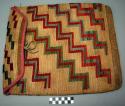 Woven vegetable fiber saddle bag with step design in colors