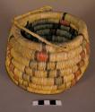 Small coiled built basket with handle