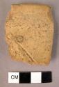 Red-brown rim potsherd - 2 stamped circles and slight hatching