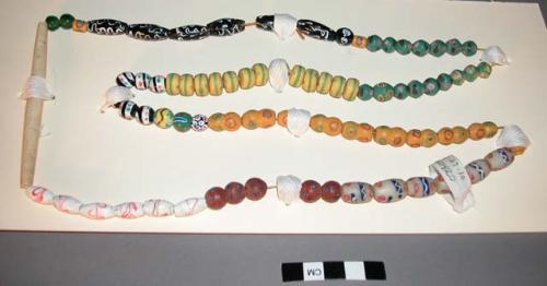 Various trade beads strung together into a necklace w/ hair pipe bone