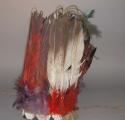 Eagle feather headdress. Cap made from hide and gray felt. Feathers dyed red. Br