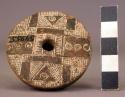 Ceramic spindle whorl, circular, incised decoration