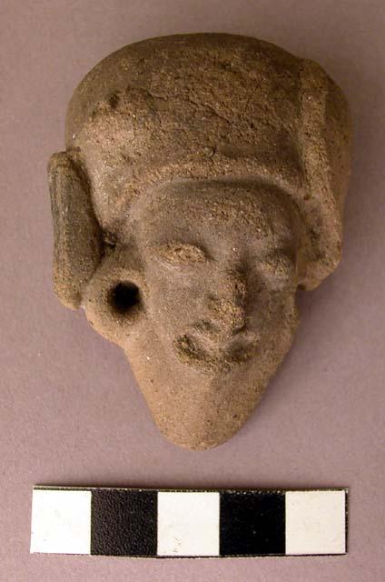 Clay figurine fragment - face