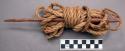 Native fiber rope and wooden needle for stringing fish - rope worn +