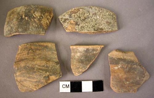 5 degenerate dark glazed pottery cup fragments