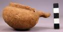 Miniature pottery dipper with zoomorphic handle, rock tempered