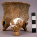 Small tripod pottery vessel with rattles in legs