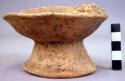 Small double-rimmed pottery bowl with pedestal base