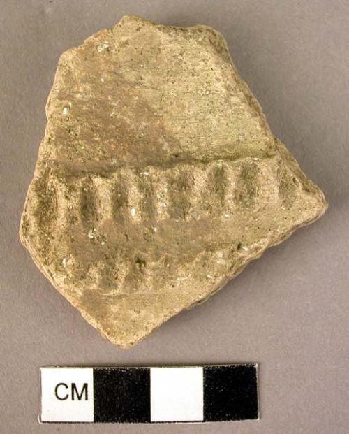 Potsherd - local ware, plastic decoration with painted trickle motif derived fro