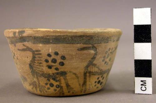 Small pottery cup with perforated base