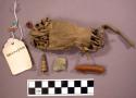 Navajo medicine bag and contents. Bag made from buckskin and has fringe at top a