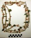 Navajo necklace. 3 strands of shell beads w/larger pieces of shell and chunks of