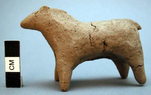 Unfired clay figurine depicting mare