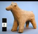 Unfired clay figurine depicting goat