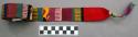 Belt; embroidered red with various colors in geometric design; 82 in. long; 1