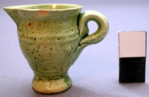 Miniature pitcher, green glazed ceramic