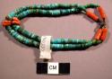 Double strand of turquoise bead bracelet with some coral beads